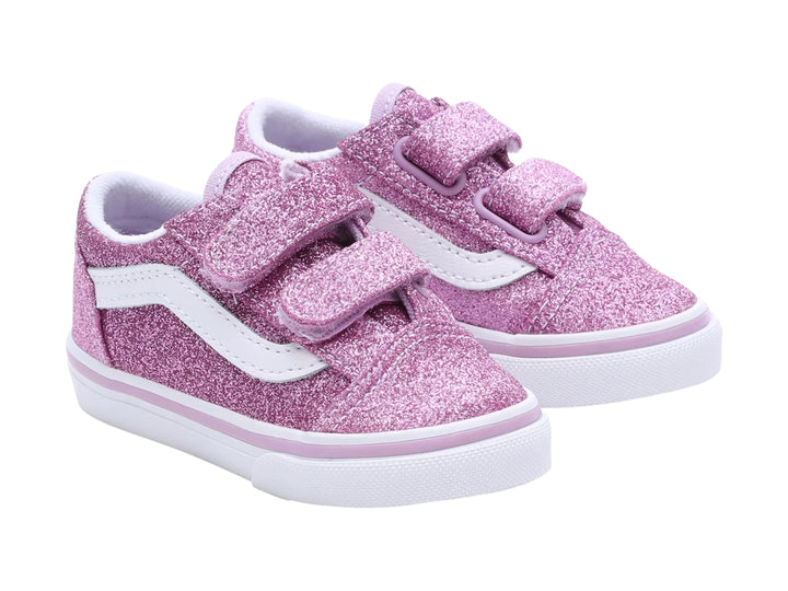 Tenis VANS Old Skool color morado brillante con suela blanca y cierres de velcro.
