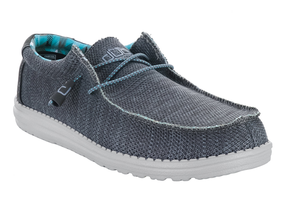 Zapato casual Hey Dude modelo Wally Sox en color gris carbón con suela blanca y forro interior estampado.