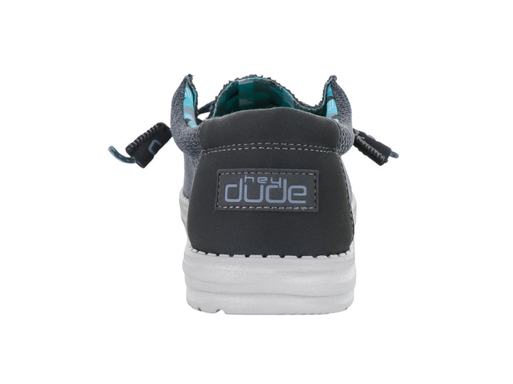 Zapato casual Hey Dude modelo Wally Sox en color gris carbón con suela blanca y forro interior estampado.
