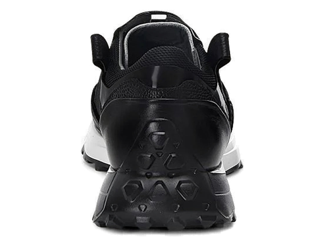 Tenis de cuero negro con suela blanca y detalles rojos laterales.