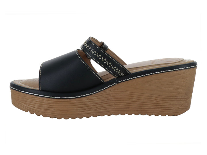 Sandalia negra de plataforma alta con suela color café y detalles de costura blanca para mujer.