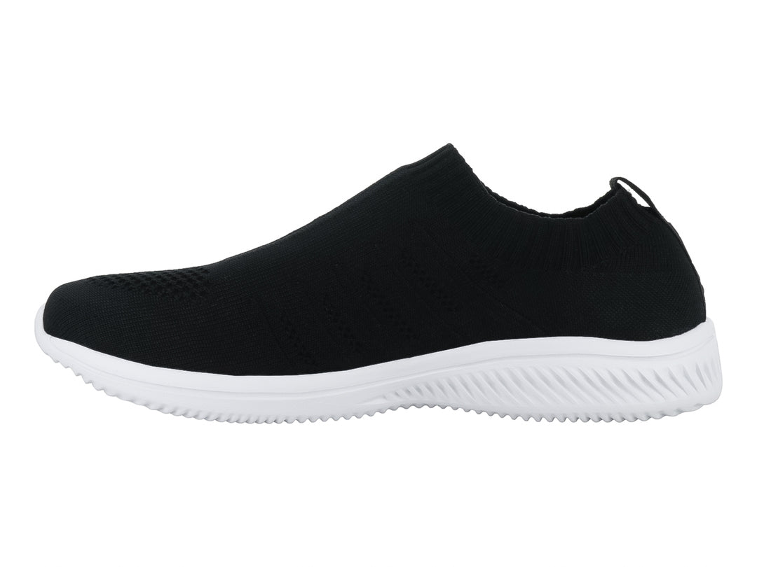 Tenis deportivos Lotto color negro con suela blanca y logotipo dorado en el lateral.