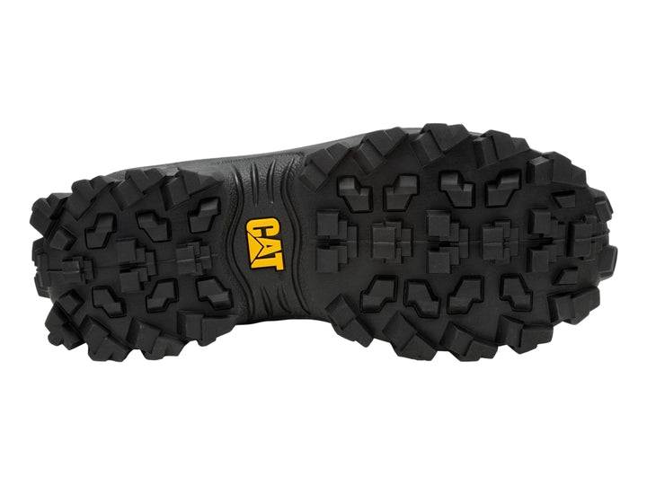 Tenis Caterpillar color negro y beige con detalles de corcho y suela robusta.
