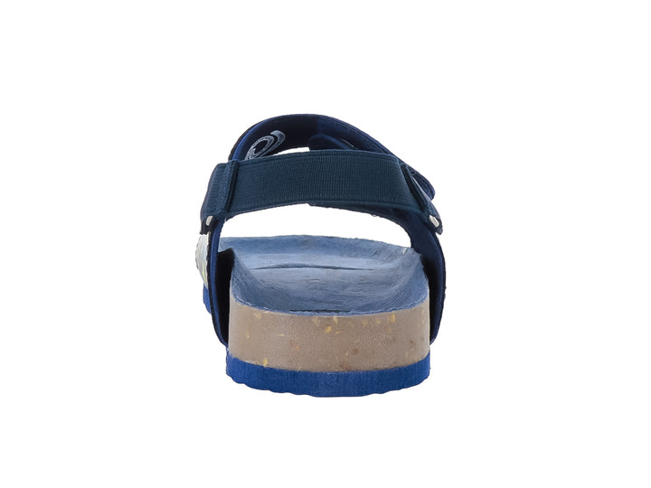 Sandalia infantil color azul marino con estampado multicolor de dinosaurios y cierres de velcro.