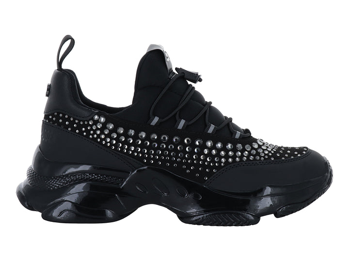 Tenis deportivos negros Steve Madden con detalles de cristales y suela chunky brillante.