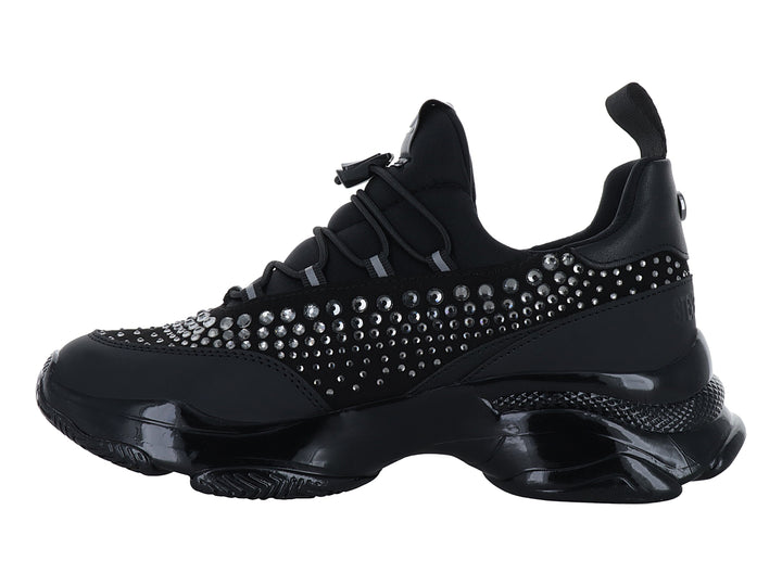 Tenis deportivos negros Steve Madden con detalles de cristales y suela chunky brillante.