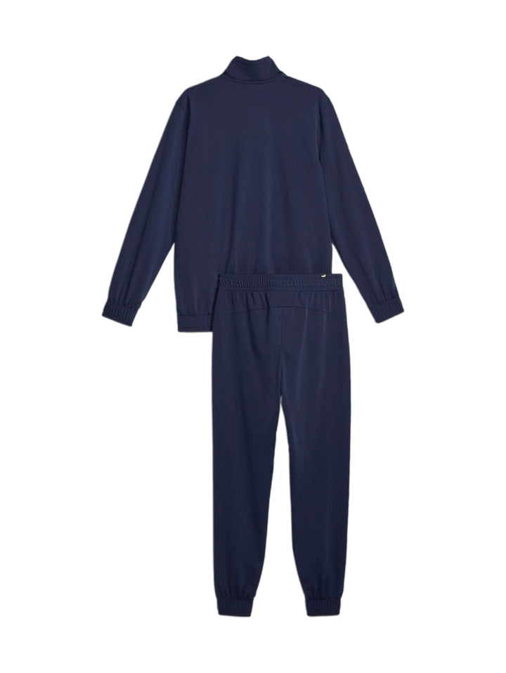 Conjunto deportivo PUMA azul marino con franja blanca en la chaqueta y pantalón a juego.