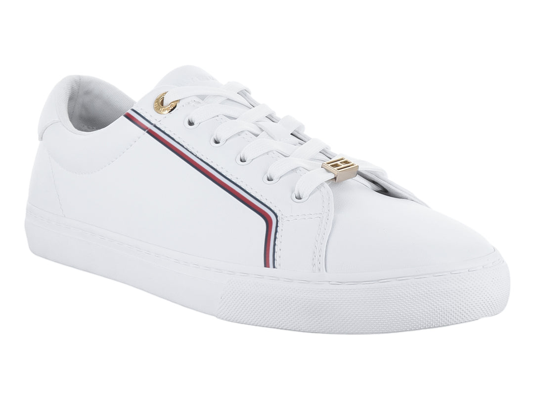 Tenis blancos de Tommy Hilfiger con franja multicolor lateral y detalles dorados.