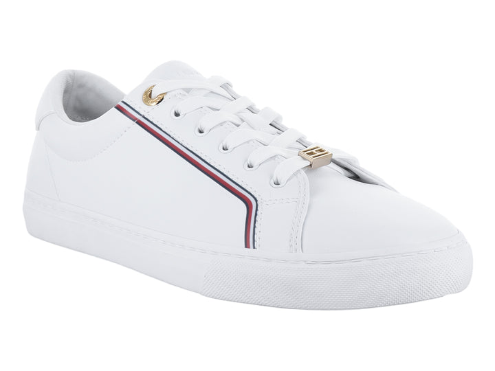 Tenis blancos de Tommy Hilfiger con franja multicolor lateral y detalles dorados.