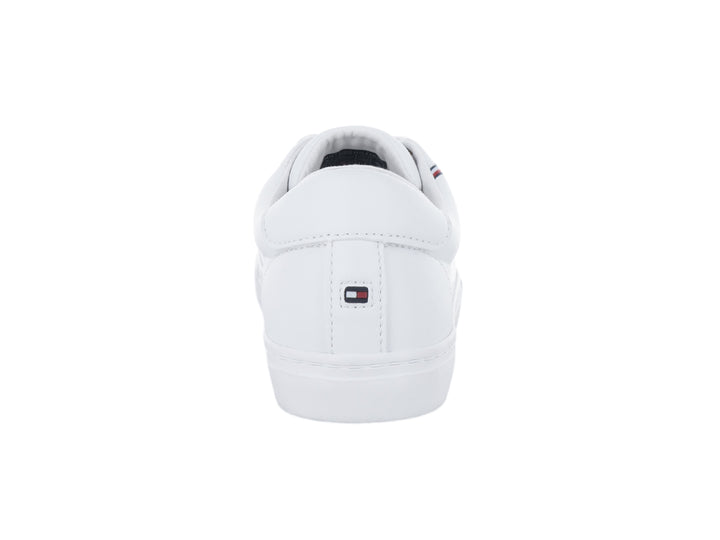 Tenis blancos de Tommy Hilfiger con franja multicolor lateral y detalles dorados.