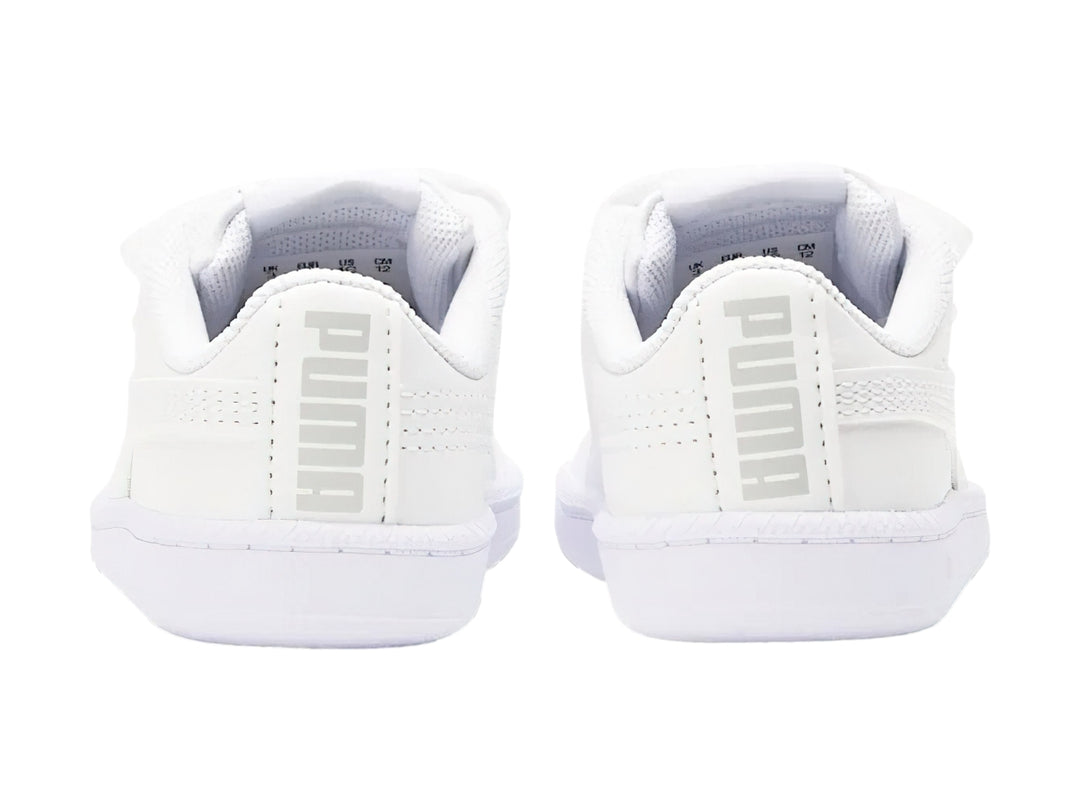 Tenis blancos PUMA para bebé con cierres de velcro y suela blanca.