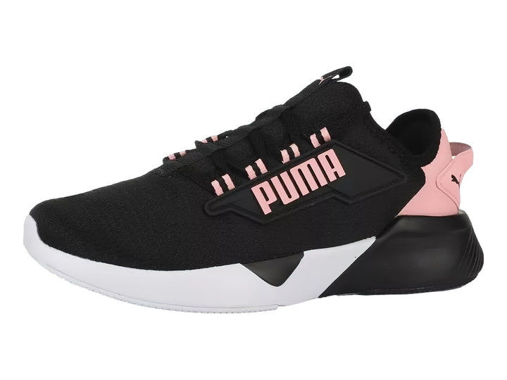 Tenis PUMA Retaliate 2 color negro con detalles en rosa y suela blanca para Mujer.