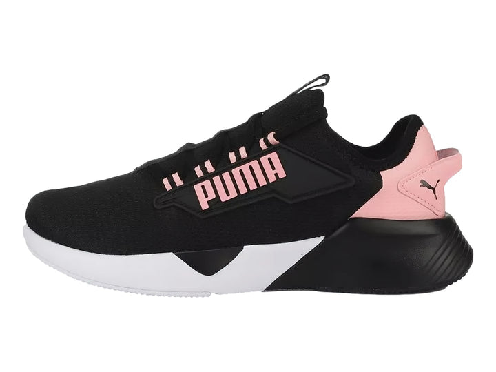 Tenis PUMA Retaliate 2 color negro con detalles en rosa y suela blanca para Mujer.