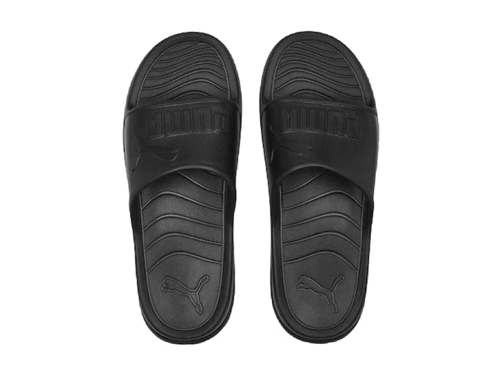 Sandalias PUMA Popcat 20 Injex en color negro sólido con diseño deportivo y correa ancha.