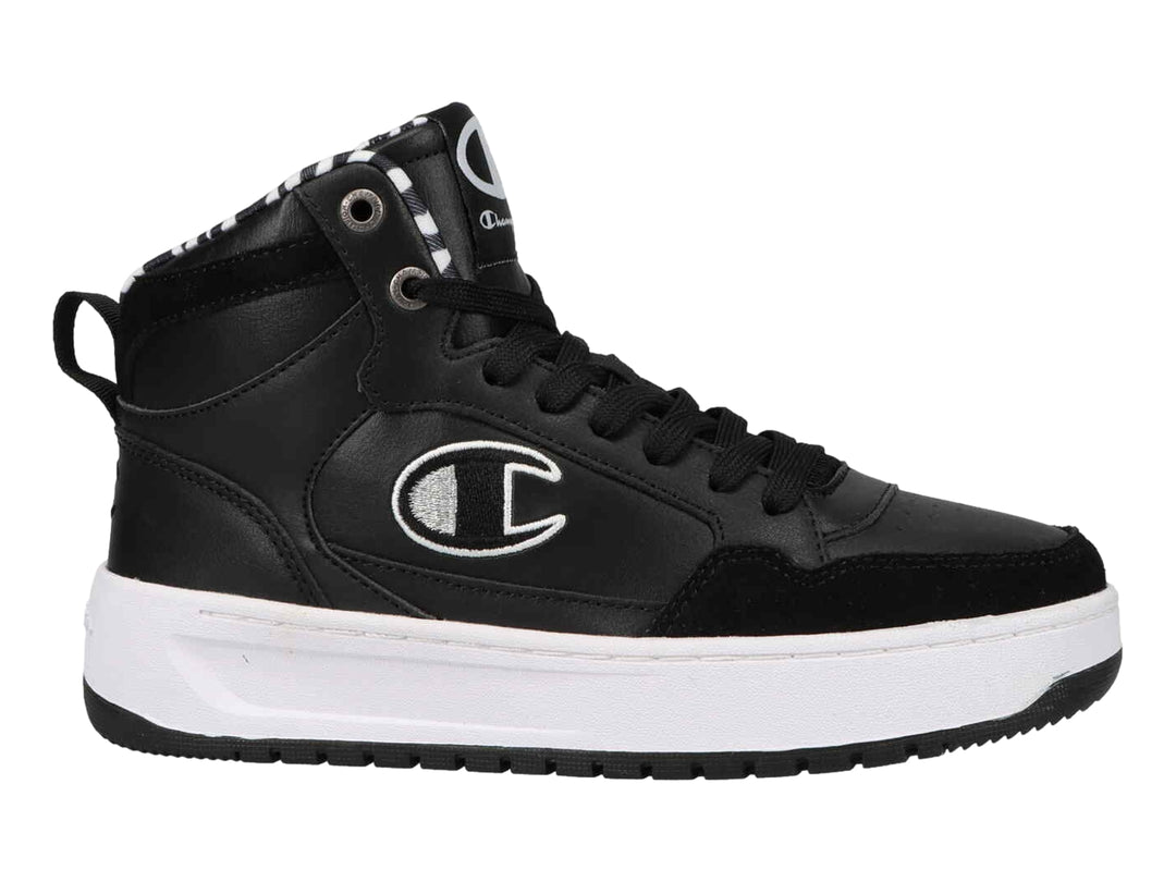 Tenis Champion de cuello alto en color negro con suela blanca y detalle de patrón cebra en el interior.