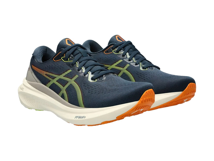 Tenis deportivos ASICS Gel-Kayano 30 color azul francés con suela blanca y detalles en verde neón.