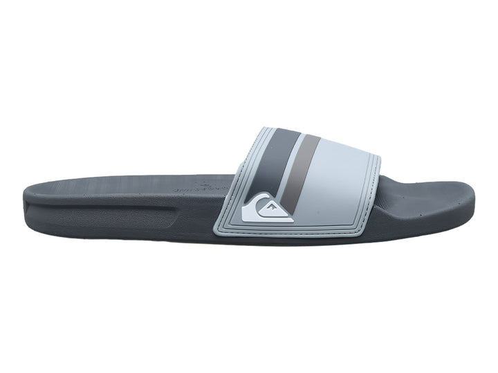 Sandalia slide Quiksilver en color gris con detalles en negro y logotipo blanco en la banda.