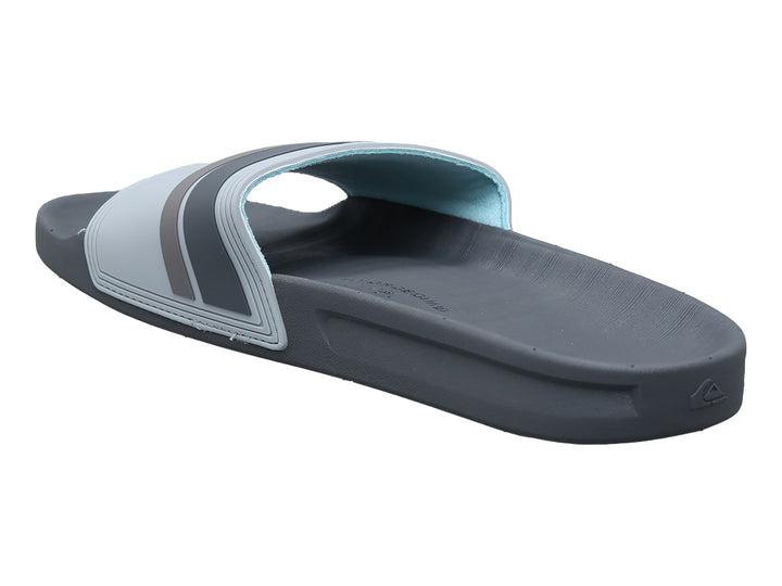 Sandalia slide Quiksilver en color gris con detalles en negro y logotipo blanco en la banda.