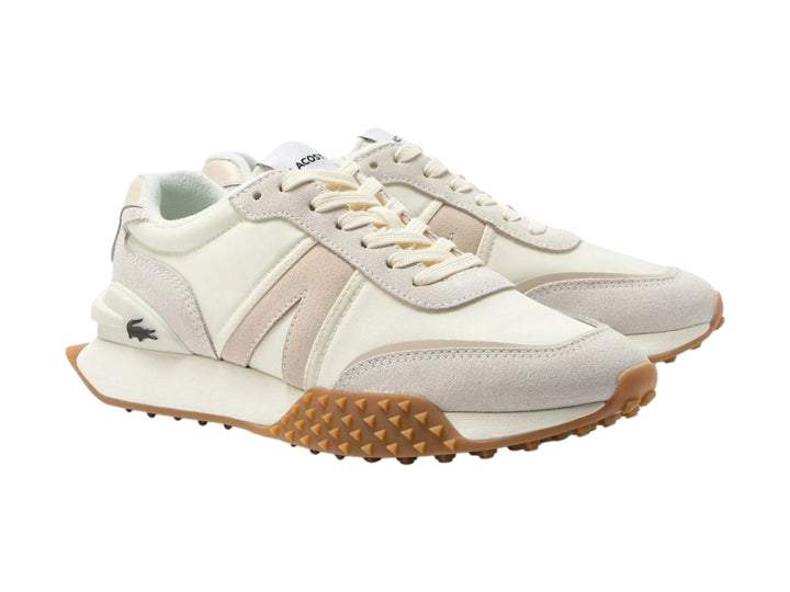 Tenis Lacoste L-Spin Deluxe en tonos blanco roto y beige con suela de goma marrón.