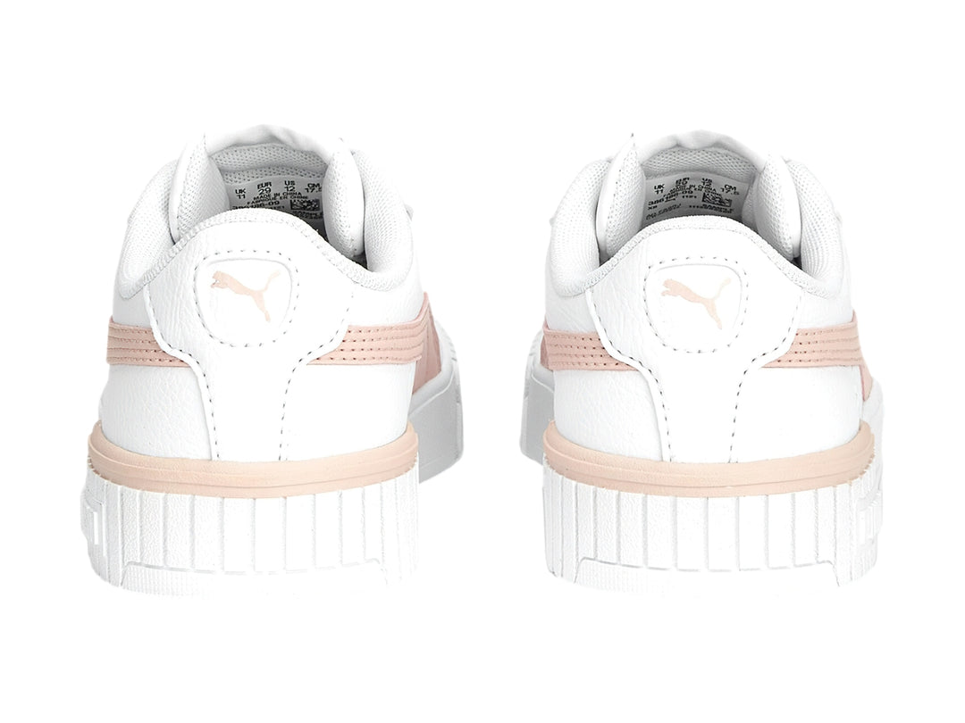 Tenis PUMA Carina 2.0 en color blanco con detalles en rosa pálido y suela blanca ancha.