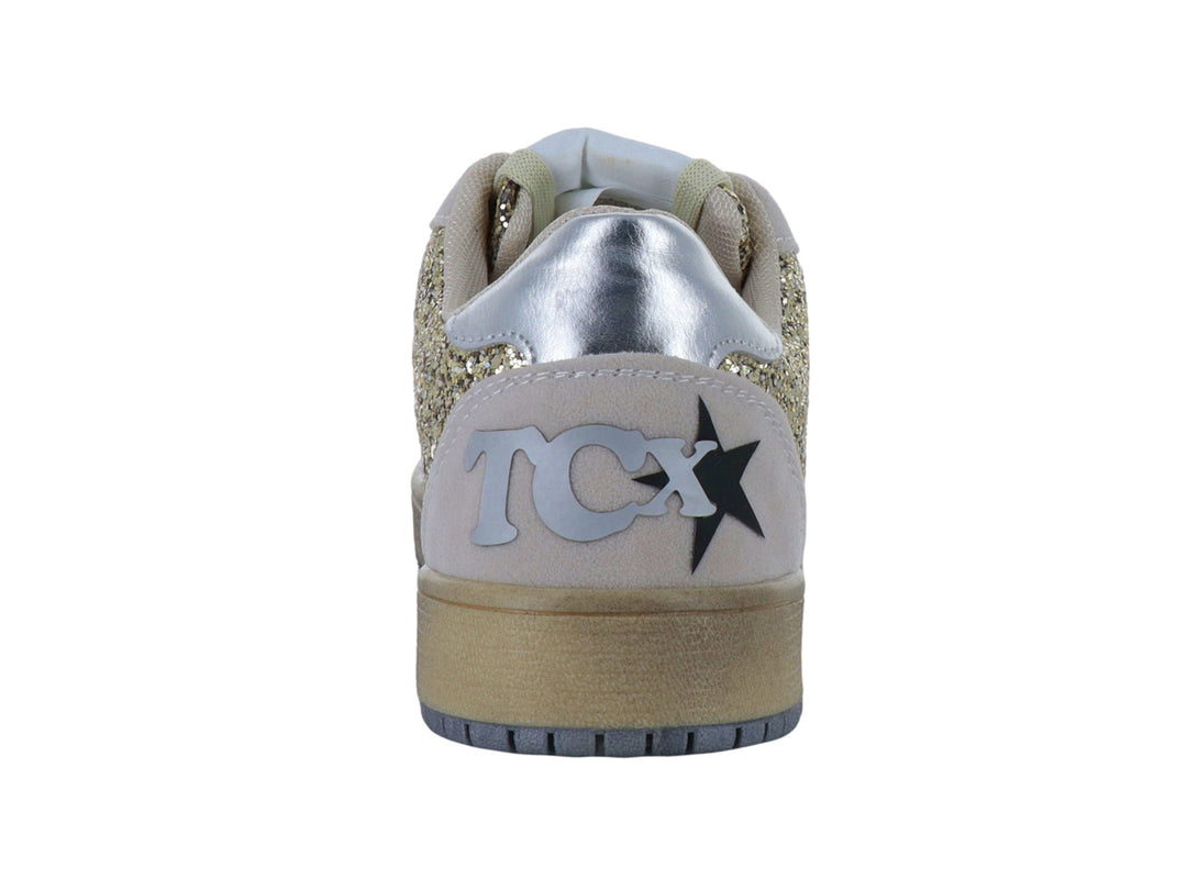 Tenis color oro con acabado brillante de glitter y detalles en gris con una estrella lateral.