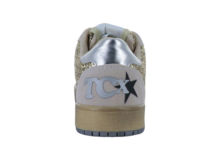 Tenis color oro con acabado brillante de glitter y detalles en gris con una estrella lateral.