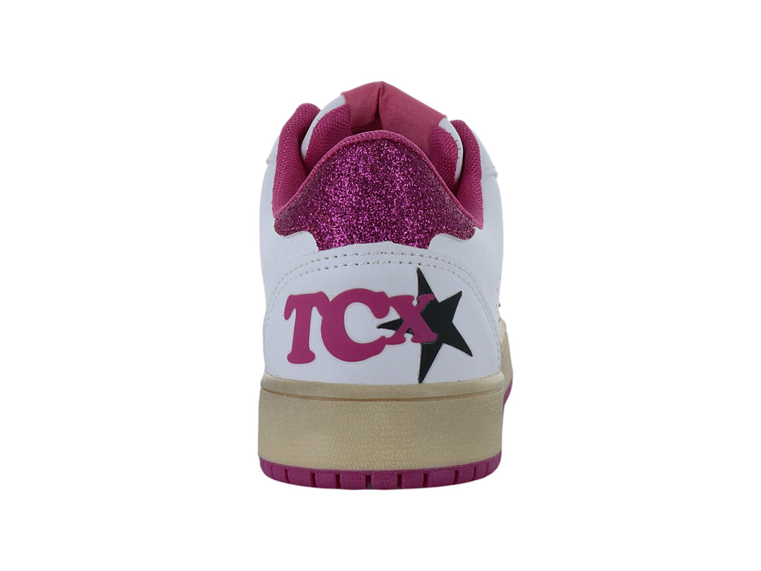 Tenis blancos con detalles de estrella y suela en color rosa brillante y beige.