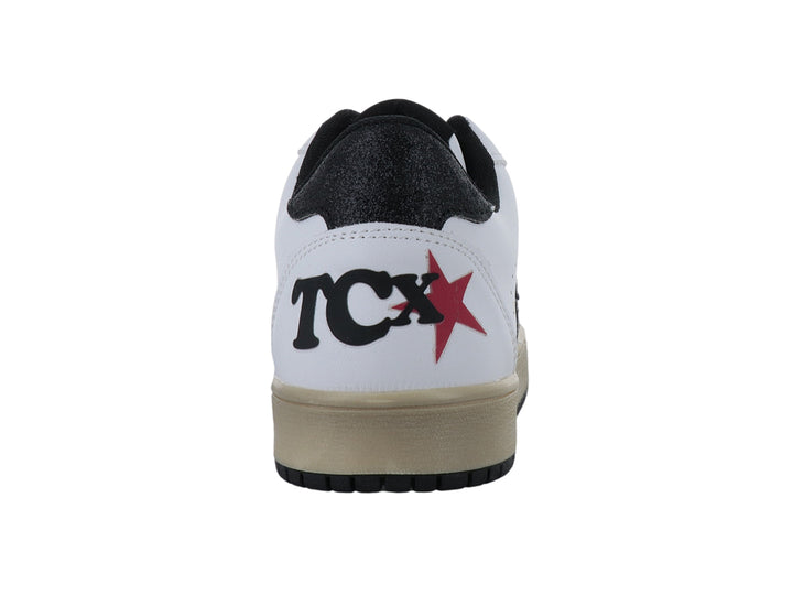Tenis blancos de la marca Ten Colours con estrella negra lateral, agujetas negras y suela en tono beige.