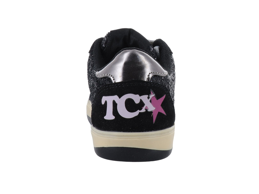 Tenis negros con glitter, detalles de estrellas plateadas y rosas, y suela color crema.