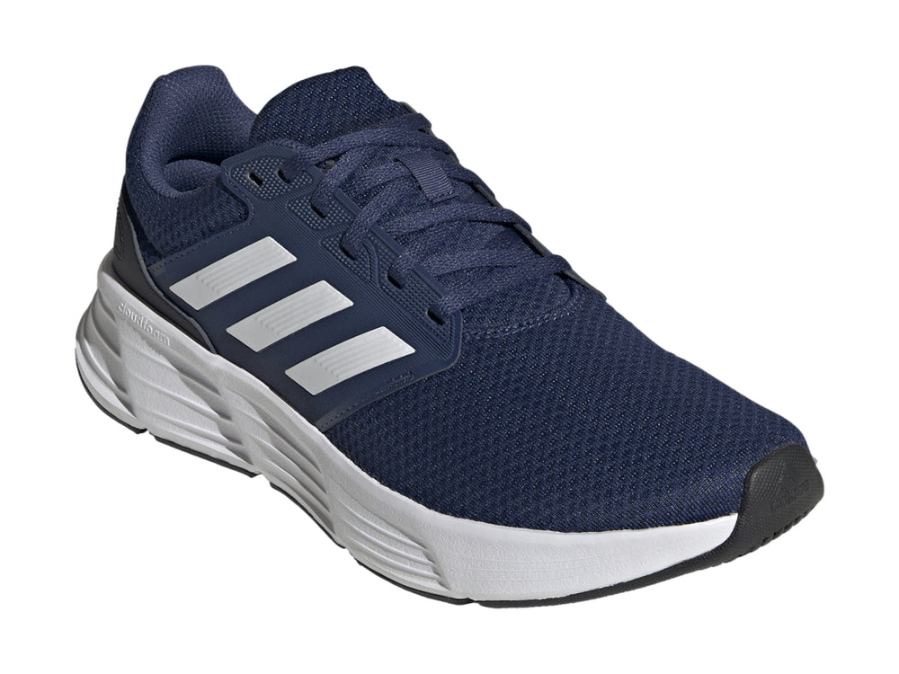 Tenis deportivos Adidas Galaxy 6 color azul marino con suela y franjas blancas.