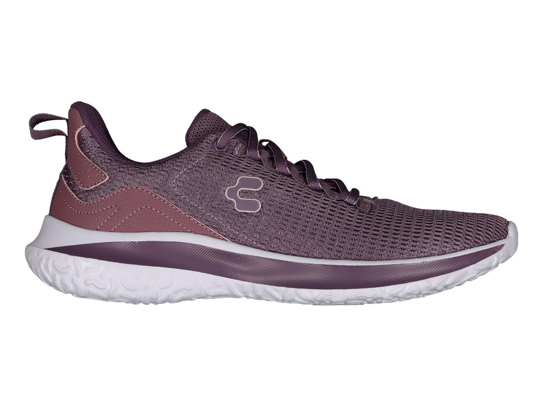 Tenis deportivos Charly en color morado con suela blanca y tejido de malla transpirable.