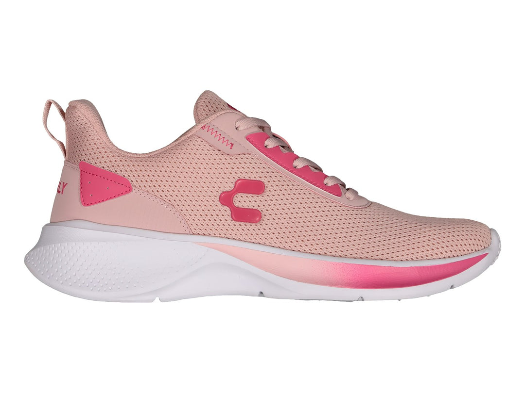 Tenis deportivos Charly color rosa con suela blanca y detalles en rosa fuerte.