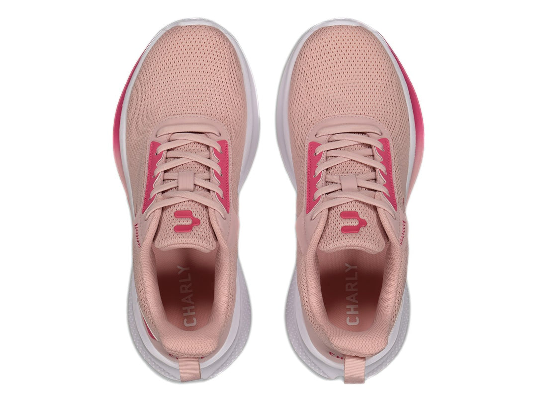 Tenis deportivos Charly color rosa con suela blanca y detalles en rosa fuerte.