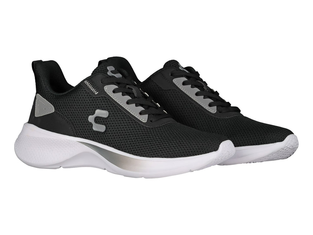 Tenis deportivos Charly en color negro con suela blanca y detalles en gris.