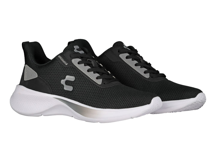 Tenis deportivos Charly en color negro con suela blanca y detalles en gris.