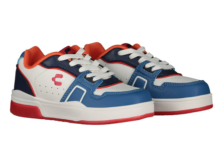 Tenis deportivos Charly en colores blanco, azul y rojo con suela roja.