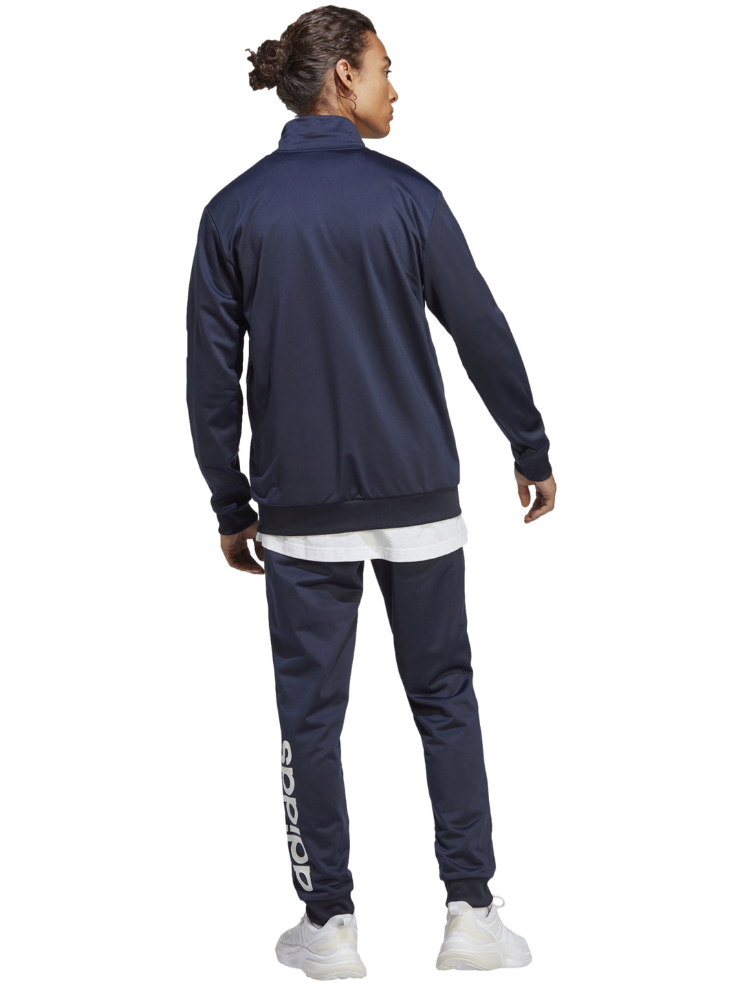 Conjunto deportivo Adidas en color azul marino, compuesto por una chaqueta con cierre y pantalón largo.