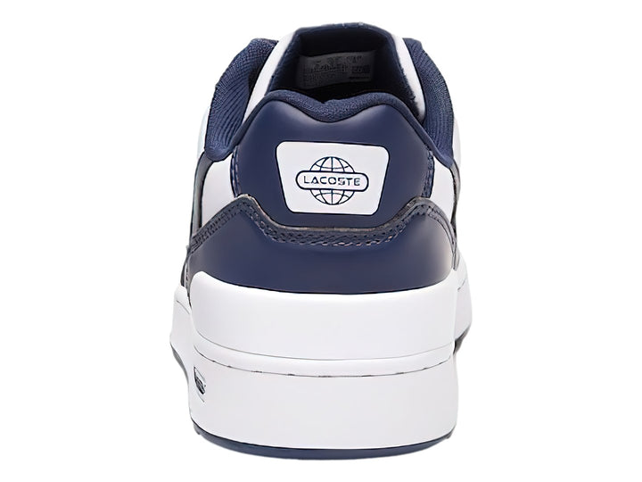 Tenis deportivos Lacoste para niño en colores blanco y azul marino con suela blanca y logotipo del cocodrilo.