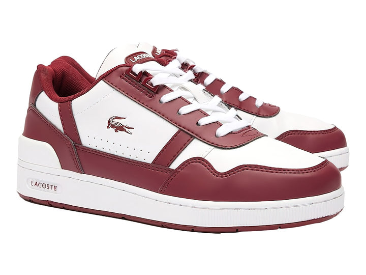 Tenis Lacoste para niños en color blanco y guinda con suela blanca y logotipo del cocodrilo.