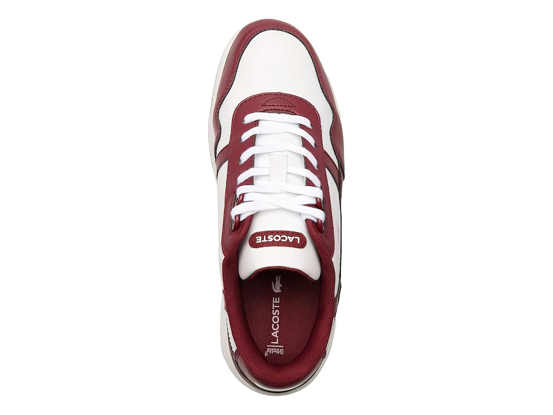 Tenis Lacoste para niños en color blanco y guinda con suela blanca y logotipo del cocodrilo.
