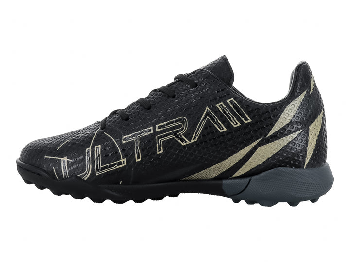 Zapato de fútbol Furia Ultra en color negro con detalles en oro y suela para césped sintético.