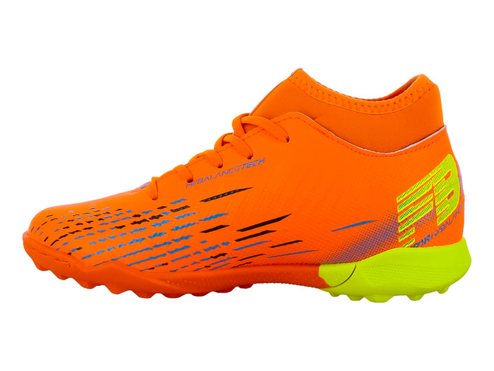 Zapato de fútbol para niños marca Furia color naranja con suela verde lima y detalles azules.