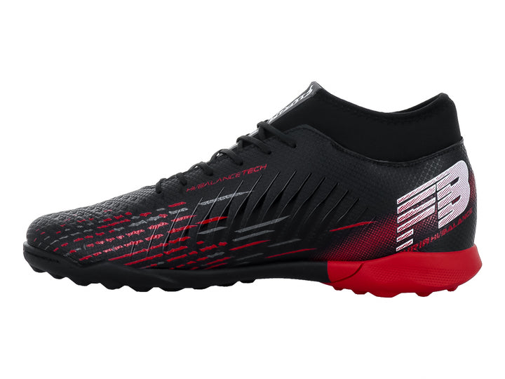 Zapato de fútbol turf marca Furia en color negro con detalles y suela trasera en rojo.