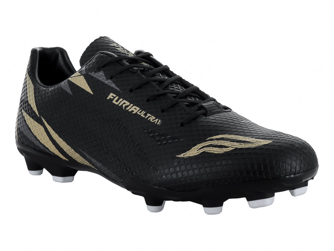 Calzado de fútbol FURIA color negro con detalles dorados y tacos blancos.