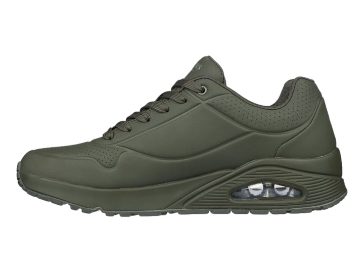 Tenis deportivos Skechers color verde oscuro con cámara de aire visible en el talón.