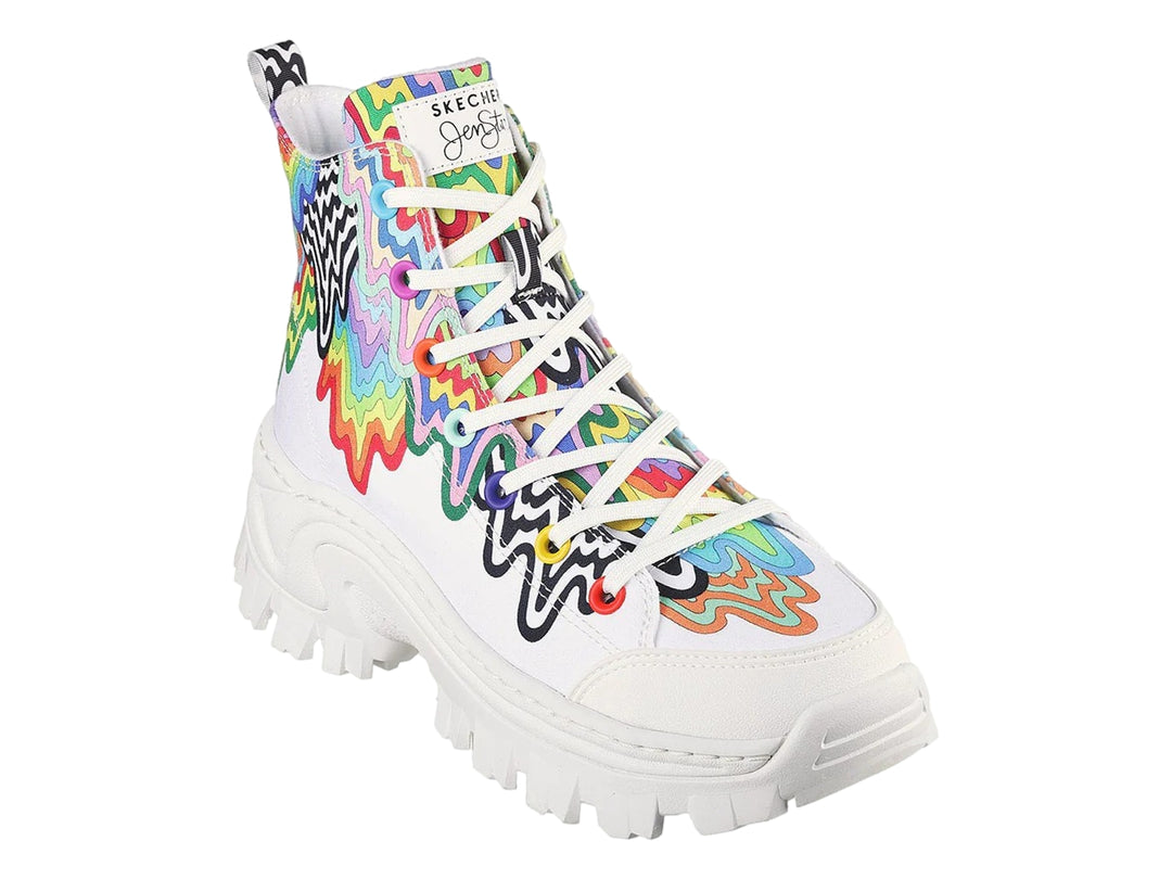 Tenis botín blancos con diseño de gotas multicolores y suela gruesa blanca.