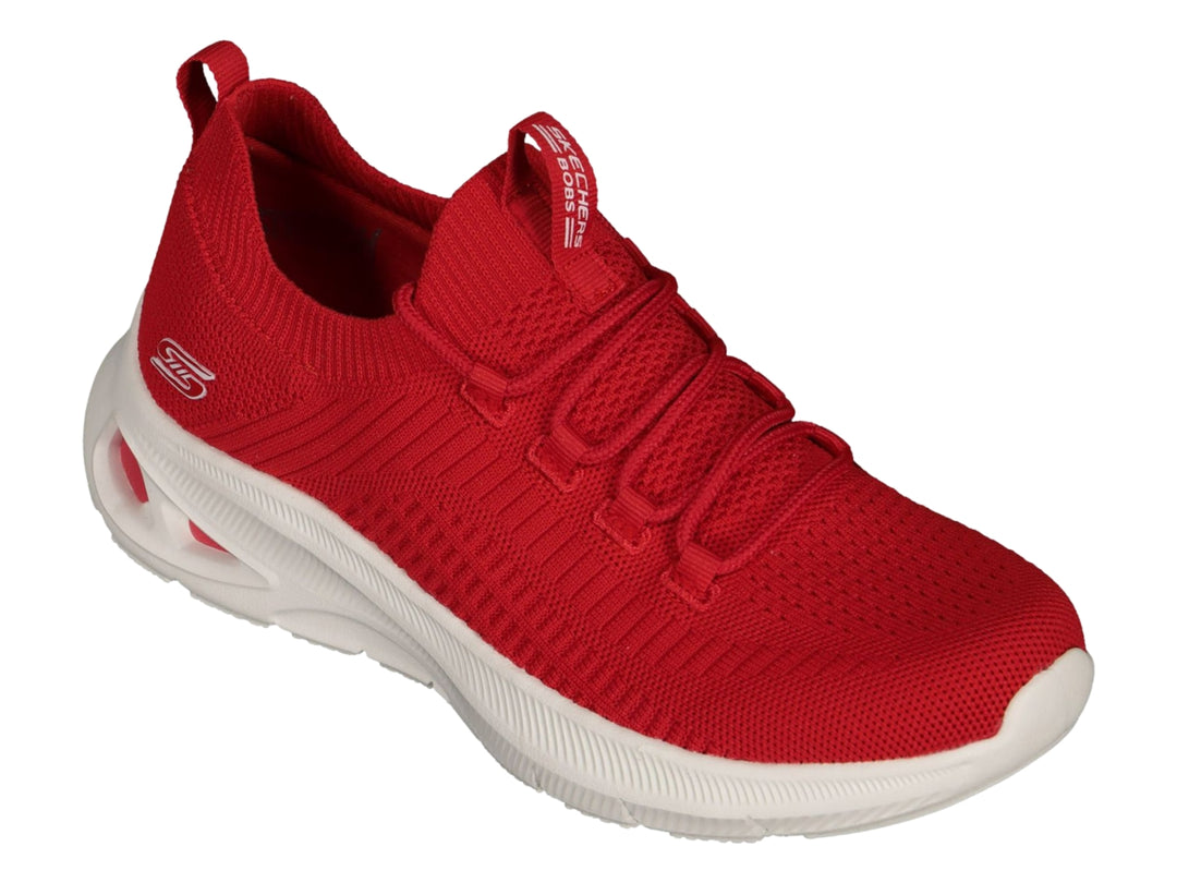 Tenis deportivos Skechers color rojo con suela blanca y tejido transpirable.