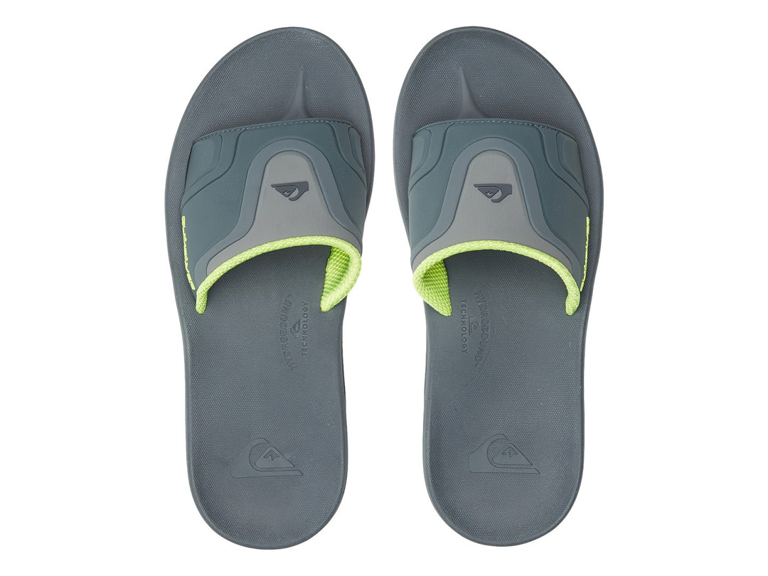 Sandalia Quiksilver color gris con detalles en verde lima, vista lateral.