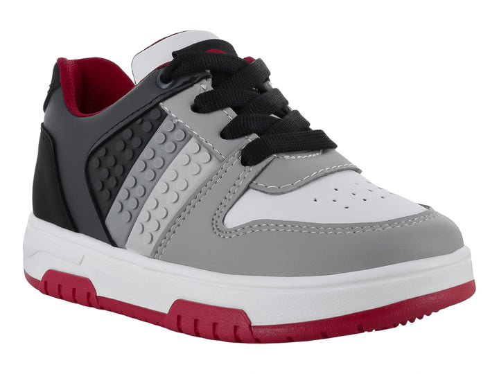 Tenis infantiles Teen Bambino en colores negro y gris con suela blanca y detalles en rojo.