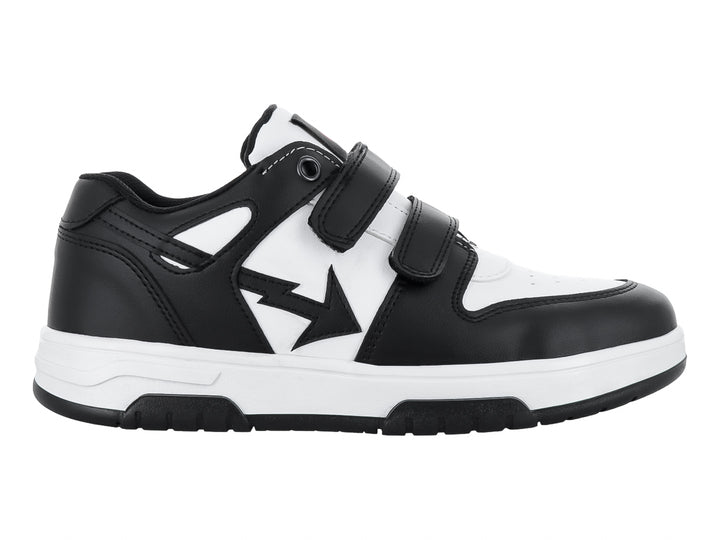 Tenis infantiles de color blanco y negro con cierre de velcro.
